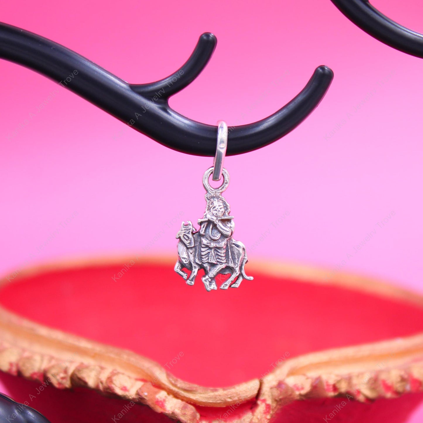 Elegant silver necklace with Krishna and Cow charm for festival wear