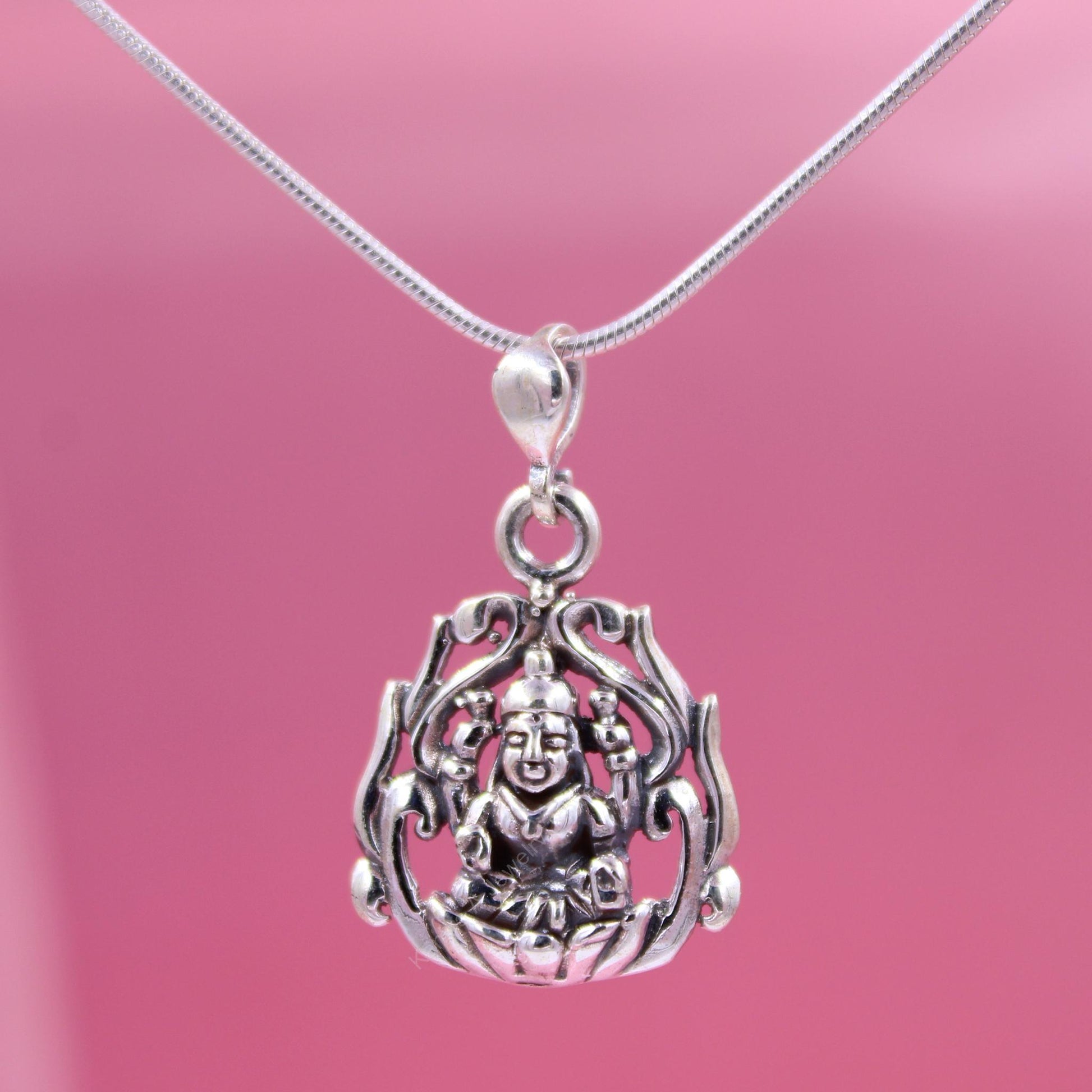 Sterling silver guardian pendant on pink background