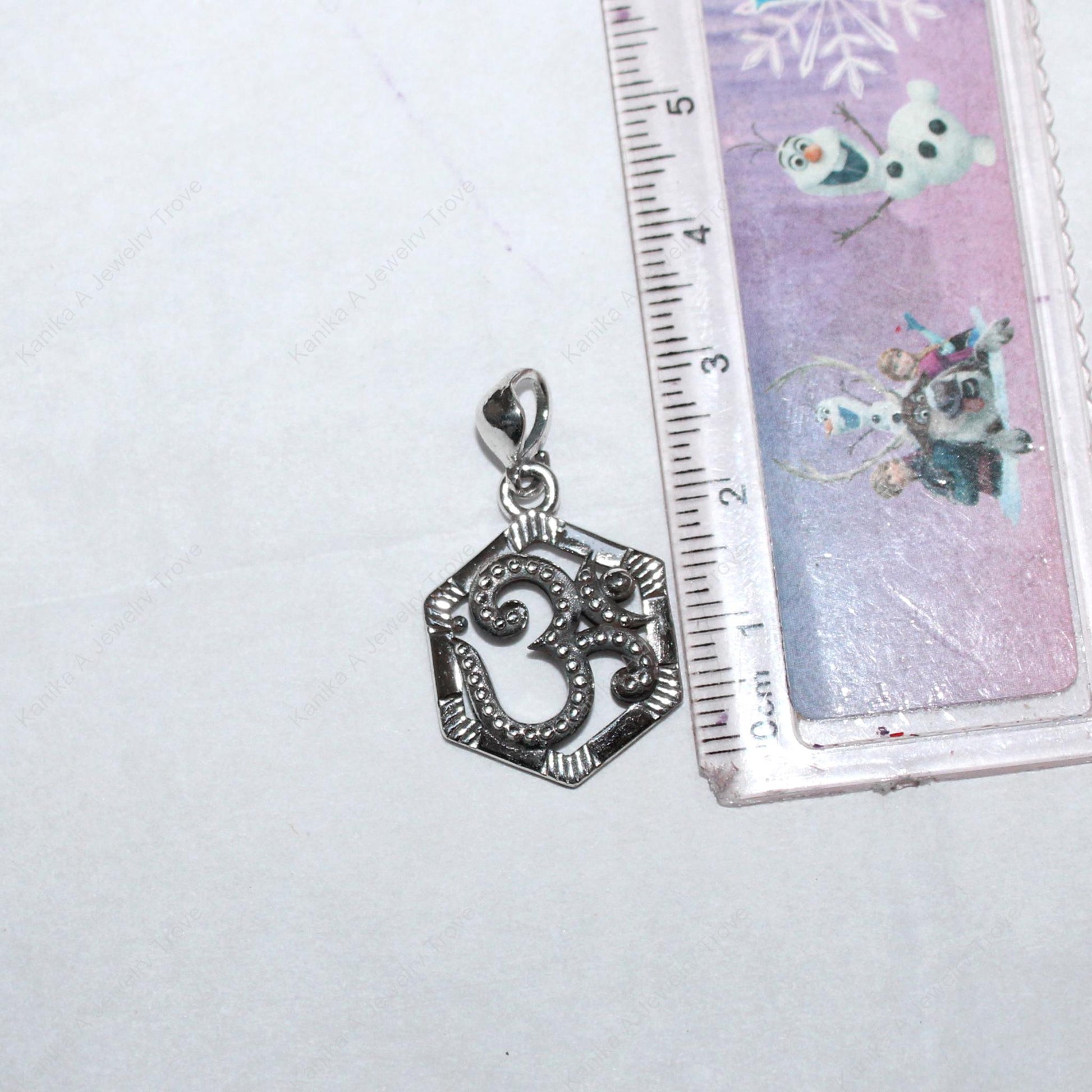 Hexagon charm with Om symbol on silver chain
