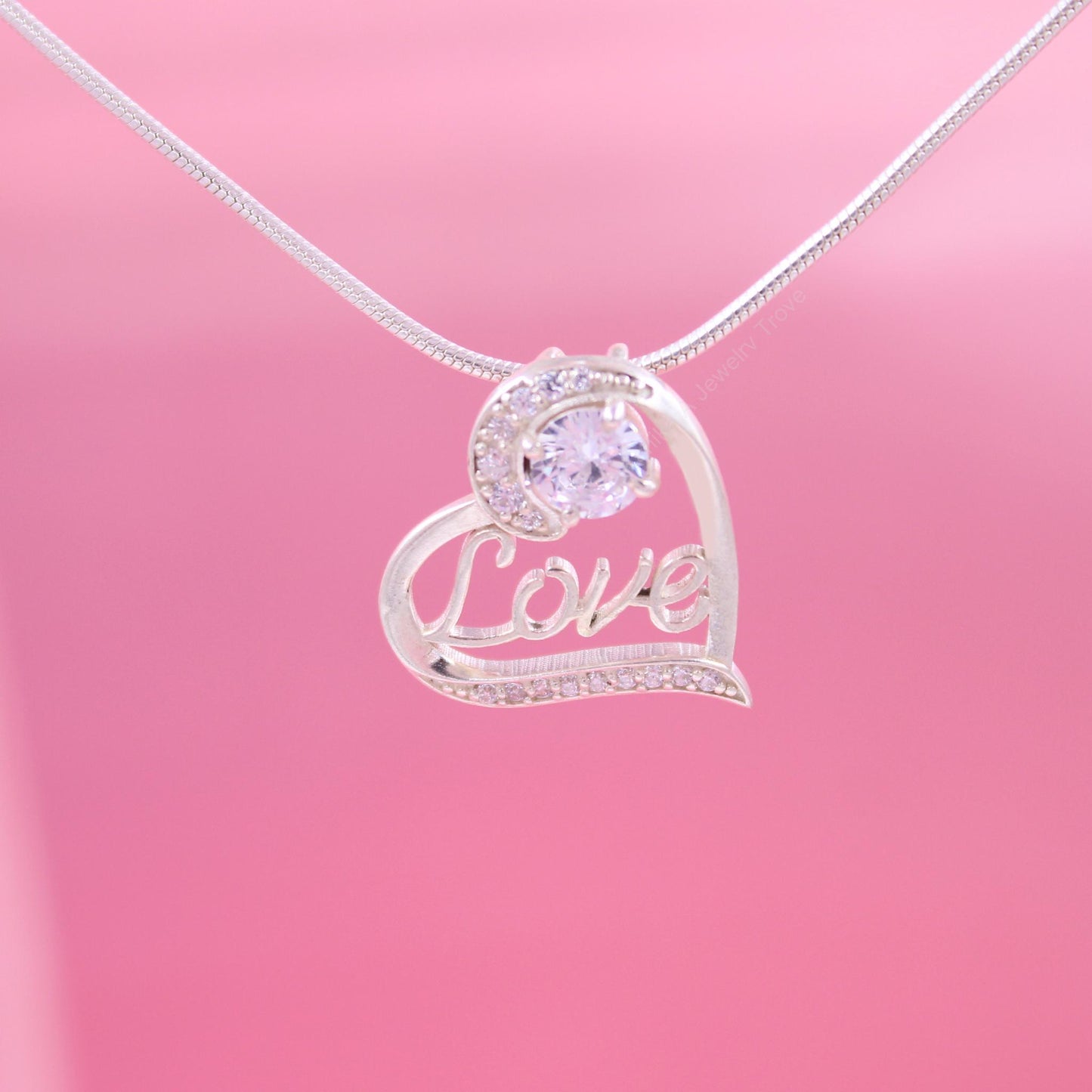 Heart-shaped love pendant with diamond accents