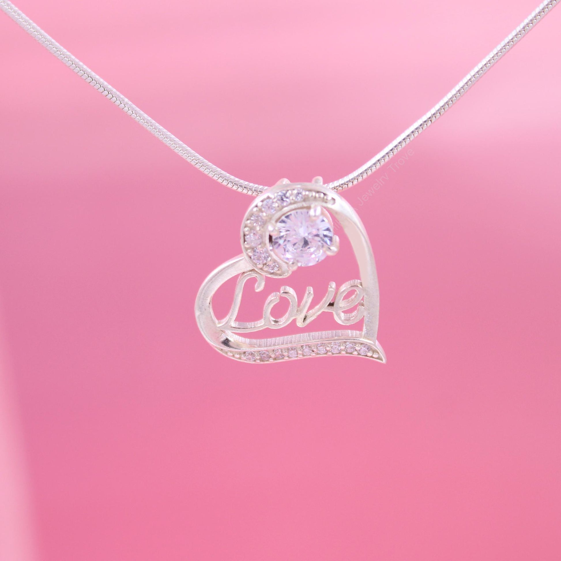 Heart-shaped love pendant with diamond accents