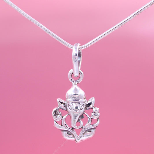 Sterling silver Ganesh necklace on pink background