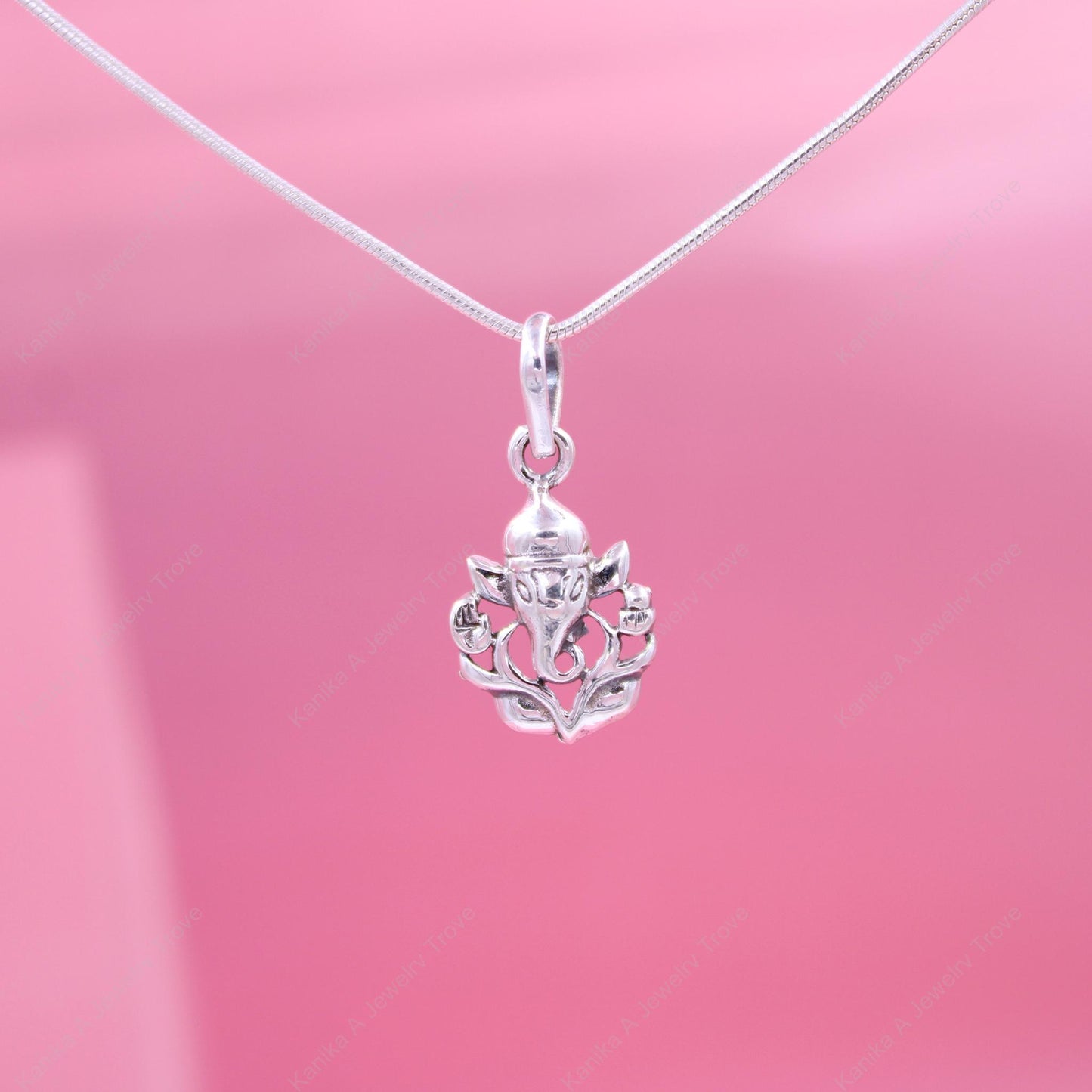 Intricate silver Ganesh pendant with fine craftsmanship