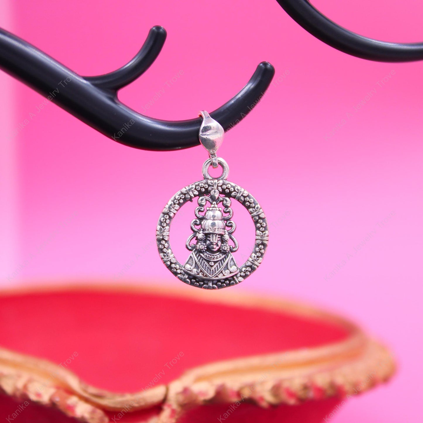 Traditional deity motif silver pendant