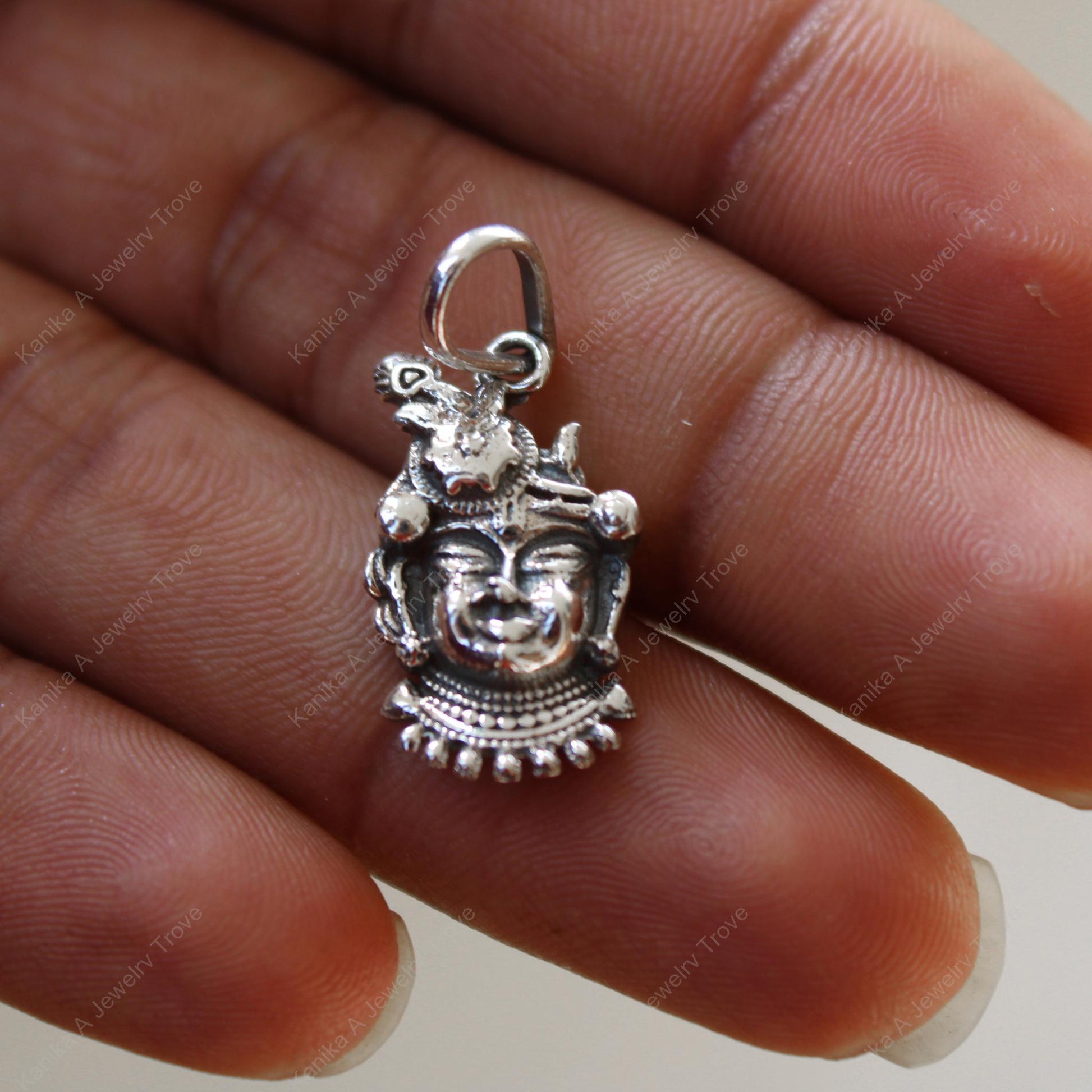 Spiritual jewelry with detailed Lord Shiva face in silver
