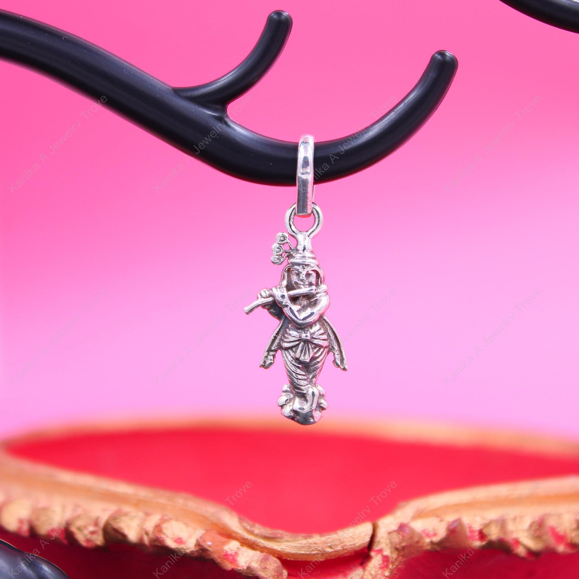 Symbolic Hindu deity charm in silver